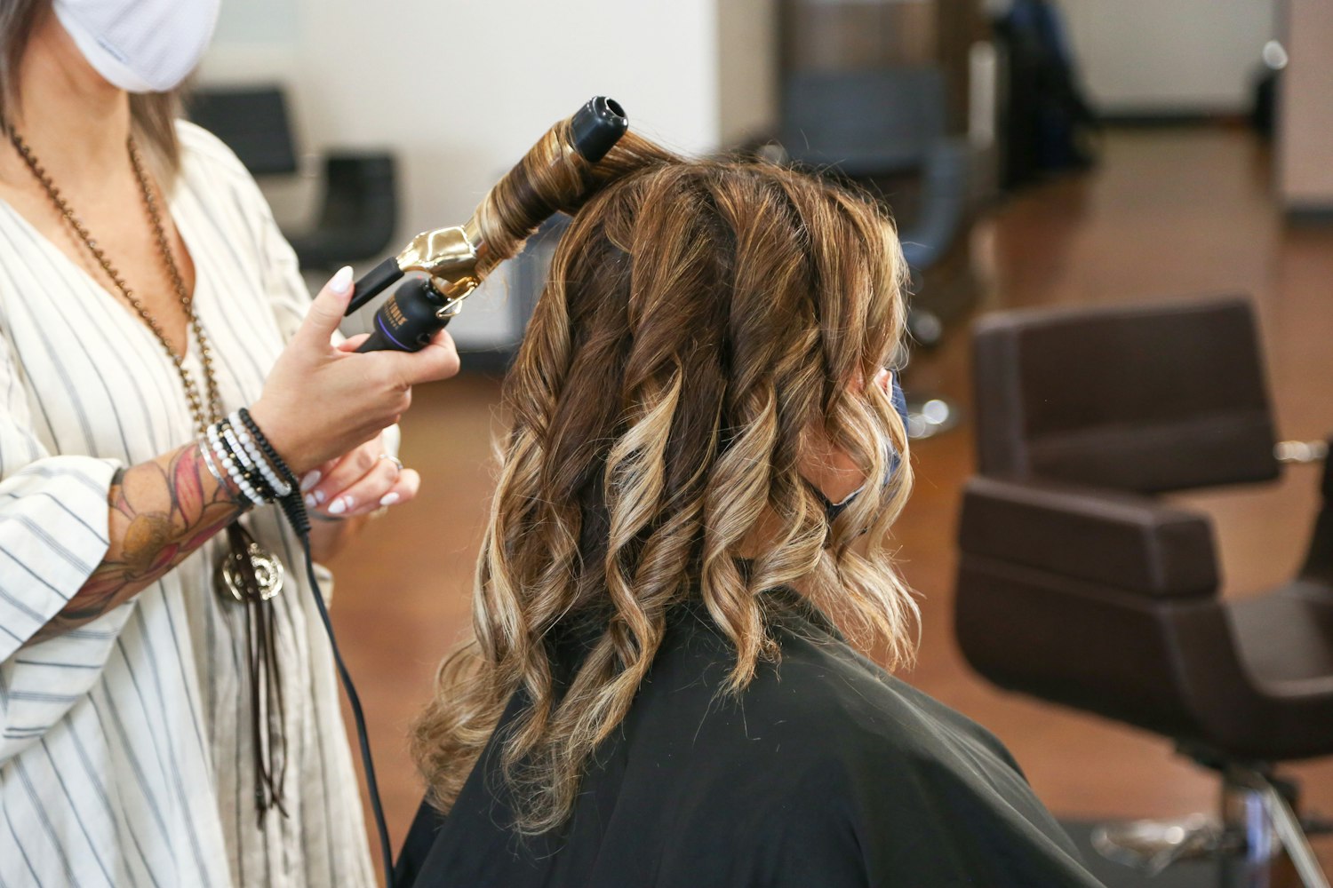 Hair being curled with a tong