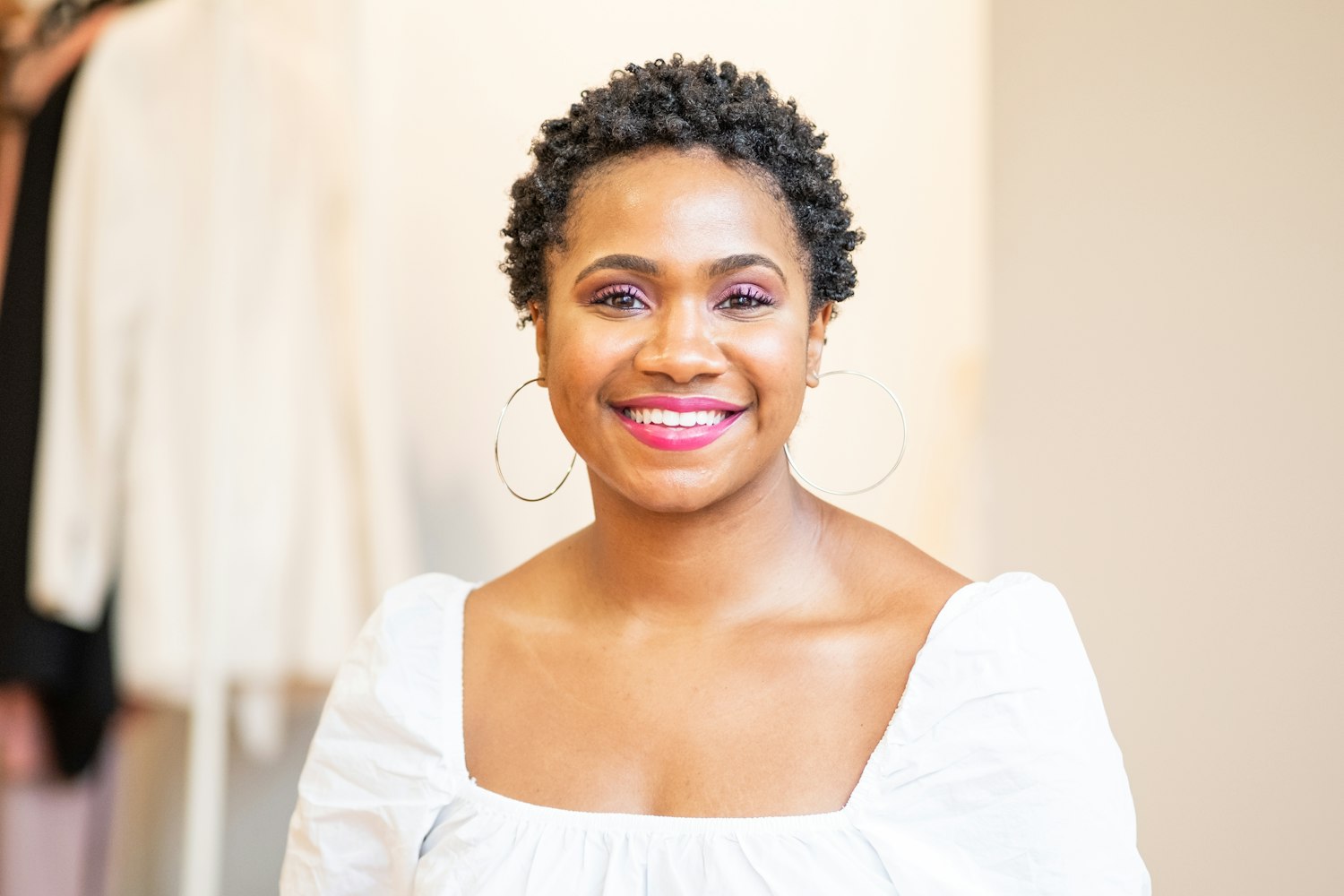Smiling woman with short natural hair