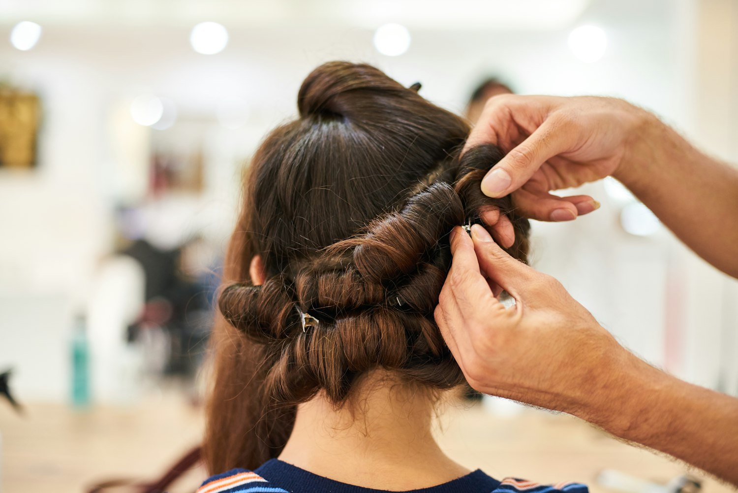 Stylist working on a client's hair